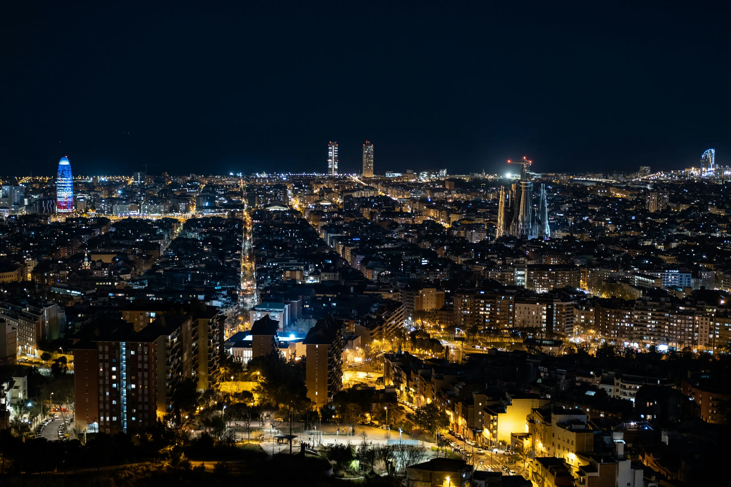 Barcelona at night from the hills, Torre Glòries lit